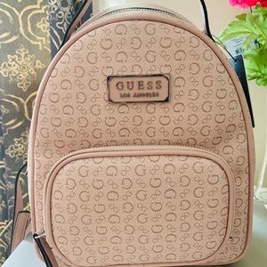 Guess Elkton small backpack justable straps and top handle.
10"W x 10"H x 4"D